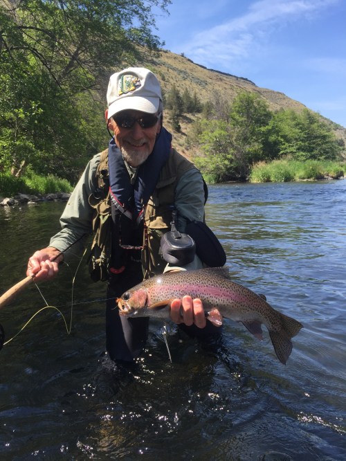 Phillip Dean with a well-fed Deschutes rainbow that pounced on a Norm Woods Special.